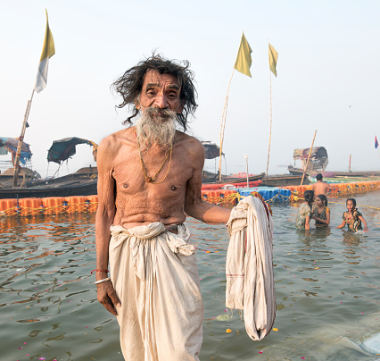 Hallahabad. India- january 17 2019: The Prayag Kumbh Mela, also known as Allahabad Kumbh Mela is a mela, or religious gathering, associated with Hinduism and held in the city of Prayagraj, India, at the Triveni Sangam, the confluence of the Ganges, the Yamuna, and the mythical Sarasvati river.[1] The festival is marked by a ritual dip in the waters, but it is also a celebration of community commerce with numerous fairs, education, religious discourses by saints, mass feedings of monks or the poor, and entertainment spectacle.[2][3] Approximately 50 and 30 million people attended the Allahabad Ardh Kumbh Mela in 2019 and Maha Kumbh Mela in 2013 respectively to bathe in the holy river Ganges, making them the largest peaceful gathering events in the world.[4][5]