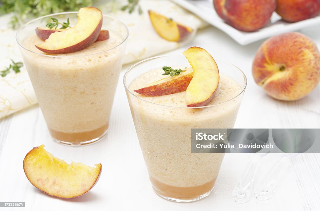 peach souffle in glasses peach souffle in glasses on a white table Cream - Dairy Product Stock Photo