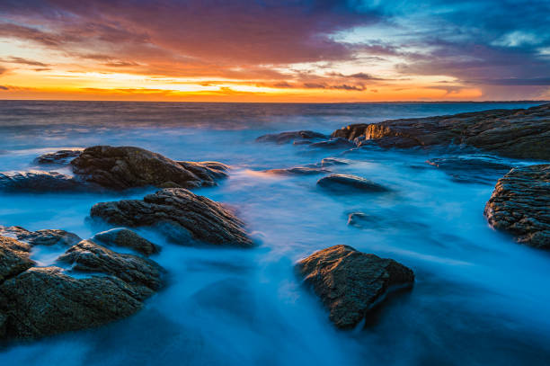 istock Sunset over Sweden's rocky coast and calm ocean 1733394849