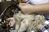 Weaving wool with a spinning wheel