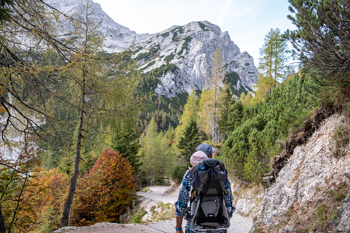 Father and his baby girl hiking in Julian Alps in Europe in Autumn.