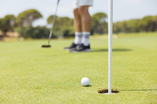 Golf ball on grass filed