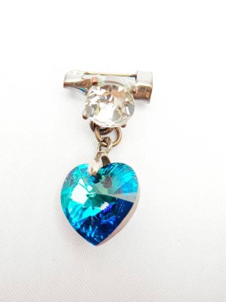 istock Selective focus of heart shape brooch isolated on white background 1733420794
