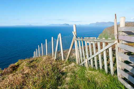 fenced on mountains by the sea