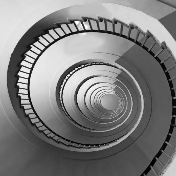 istock Spiral staircase seen in perspective with the steps going towards infinity 1733480455