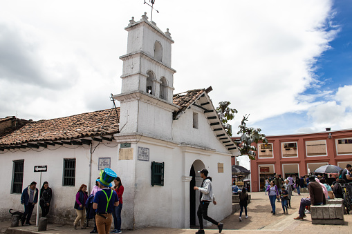 Bogota, Colombia - July 2nd 2023. Tourists at the Hermitage of San Miguel del Principe in the famous Chorro de Quevedo, the location where Gonzalo Jimenez de Quesada first established the foundations of Bogota in 1539.