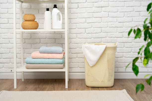 istock Beige plastic basket for laundry in a room 1733499061