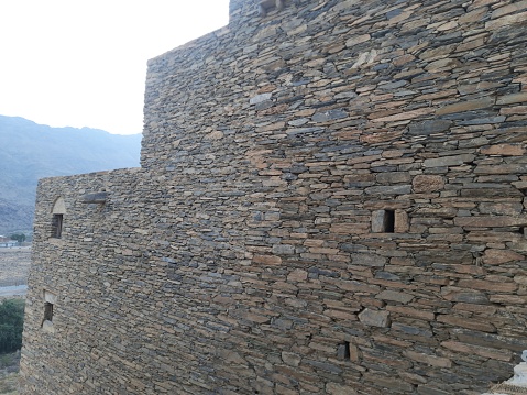 Saudi Arabia, Al-Baha, the ancient heritage village of Thee Ain( Zee Ain),houses, mosques, towers and forts with their unique stone walls and wooden doors and windows, located in the middle of the mountains and next to  banana plantations
