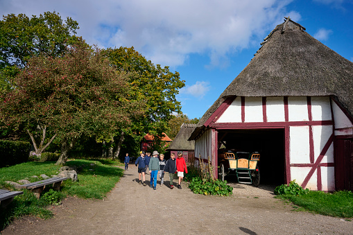 The village is a collection of more than 20 buildings from the 19th century that have been moved from their original location to the location in Odense giving the impression of a complete village from the time.