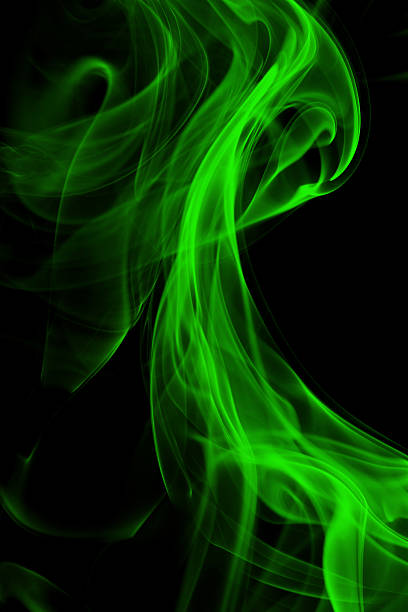 Bright green trail of smoke on a black background stock photo