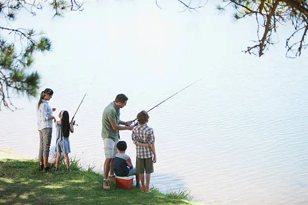 Photo of Family fishing lakeside