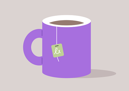 A mug with a tea bag steeping inside, symbolizing the preparation of a hot beverage