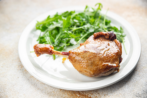 duck leg confit with berry sauce poultry meat second course vegetable delicious healthy eating cooking appetizer meal food snack on the table copy space food background rustic top view