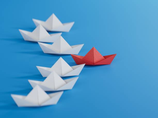 istock Different business concept.new ideas. paper art style. creative idea.Business competition concept with Colorful paper ships.3D rendering on blue background. 1733609921