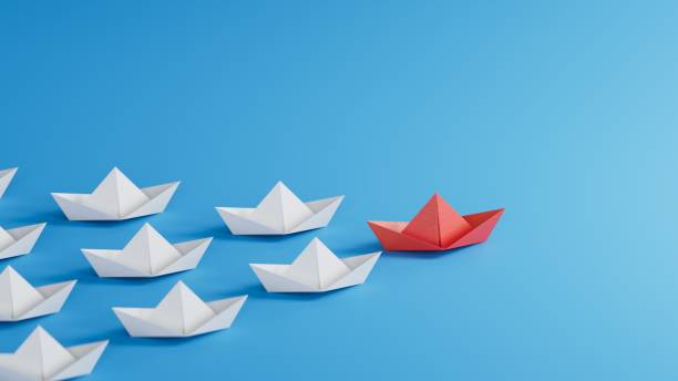 istock Different business concept.new ideas. paper art style. creative idea.Leadership concept, red paper ship leading among white.3D rendering on blue background. 1733609924