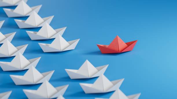 istock Different business concept.new ideas. paper art style. creative idea.red leader boat, standing out from the crowd of white boats.3D rendering on blue background. 1733609936