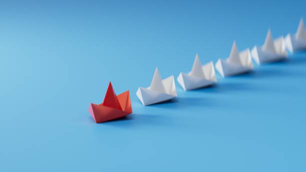 istock Different business concept.new ideas. paper art style. creative idea.Leadership concept, red leader boat leading white boats.3D rendering on blue background. 1733609942