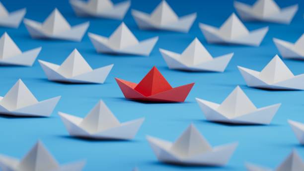 istock Different business concept.new ideas. paper art style. creative idea. red leader boat, standing out from the crowd of white boats.3D rendering on blue background. 1733609943
