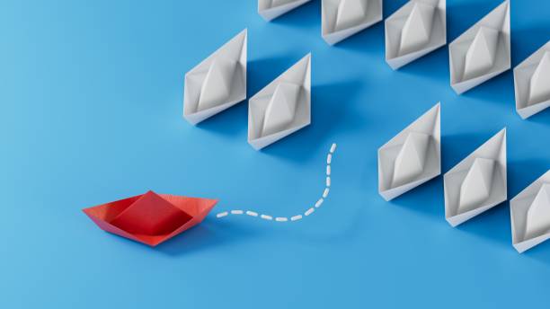 istock Different business concept.new ideas. paper art style. creative idea.Leadership concept using red paper ship among white boats.3D rendering on blue background. 1733610463