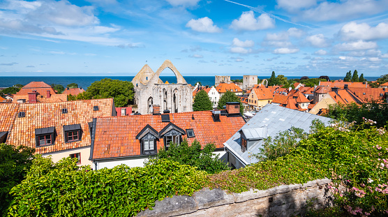 Panoramic view of medieval town Visby. Red rooftop houses and historic ruins on the Island of Gotland, Sweden, Scandinavia. Travel image.