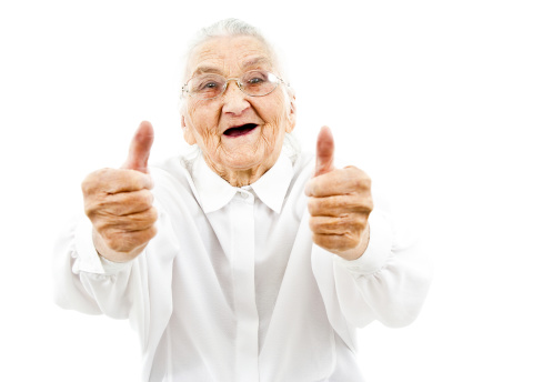 happy old woman showing thumbs up on both of her hands