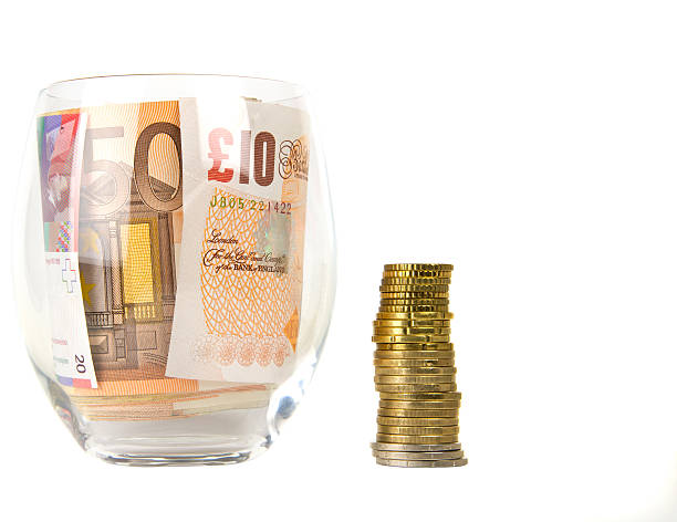 istock Currency in glass and coins 173365330