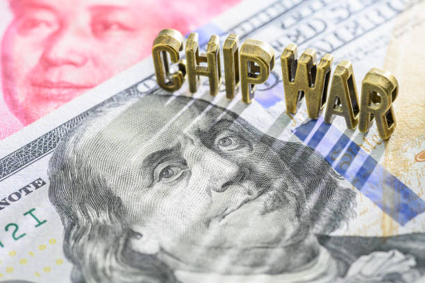 istock US and China semiconductor war, technology concept : The word CHIP WAR on US dollar and Chinese yuan notes. Chip war involves fierce competition, export restrictions and national security concerns. 1733667714
