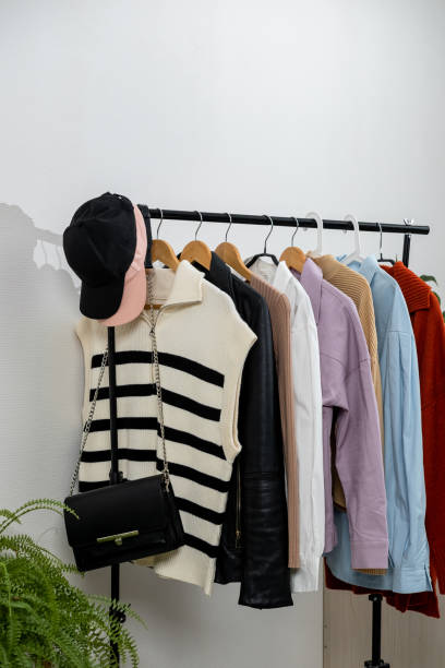 istock Rack with stylish women's clothes. Capsule minimal wardrobe 1733671330