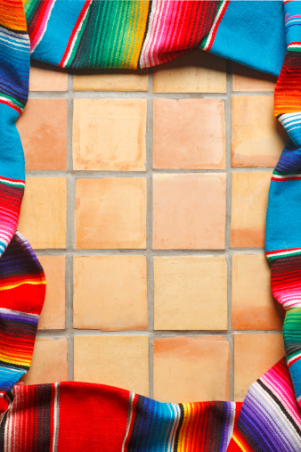 A border created by Mexican blankets on Mexican saltillo tiles.