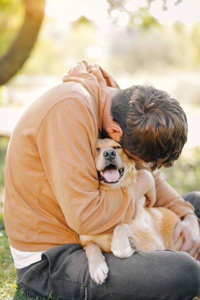 istock Guy and his dog, golden retriever, nature 1733697747