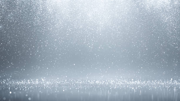 серебристые частицы, падающие вниз - абстрактный фон, яркий блеск, снег, конфетти - glitter defocused illuminated textured effect стоковые фото и изображения