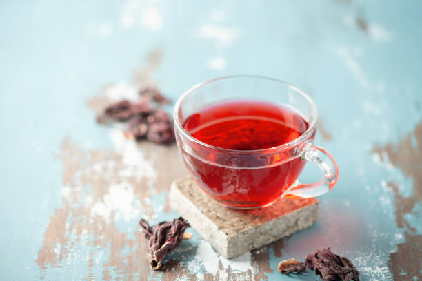 istock Red tea carcade in glasses and dried hibiscus flowers. 1733707285