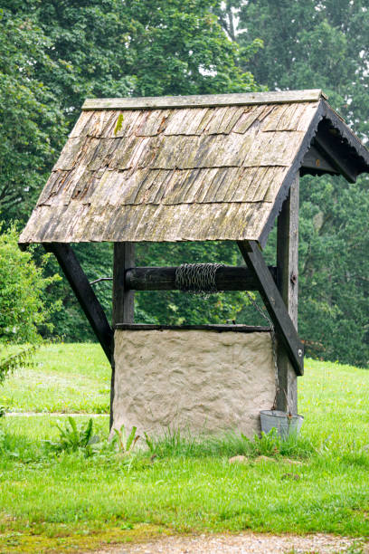 istock An old well with a shingled roof. 1733736939