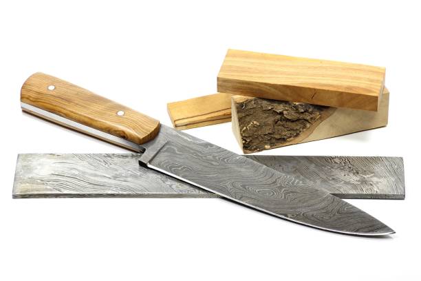 istock handmade damascus kitchen knife with raw materials 1733741399