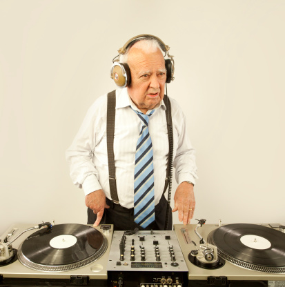 a very funky elderly grandpa dj mixing records