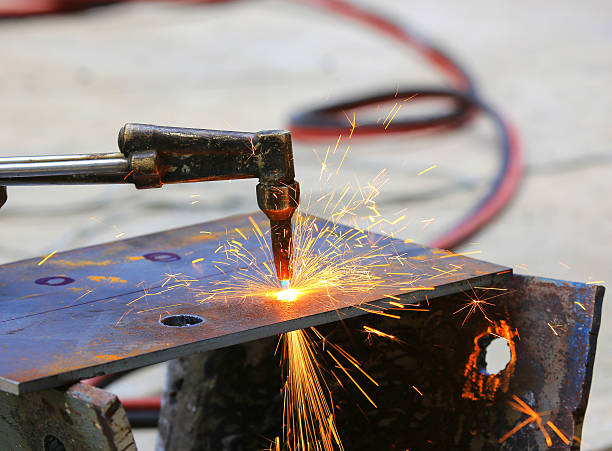 Steel plate cutting by gas machine Steel plate cutting by gas machine oxyacetylene stock pictures, royalty-free photos & images