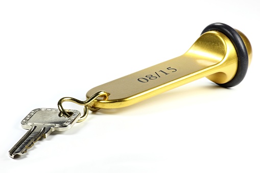 08/15 hotel key isolated on white background. 08/15 is a (German) phrase and means ordinary/ unspectacular