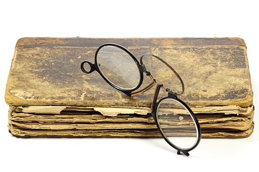 Old reading eyeglasses on the table.
