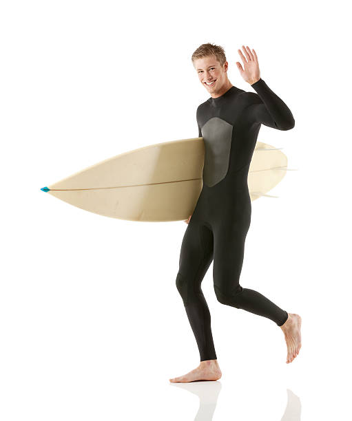 istock Portrait of a surfer with surfboard waving his hand 173377496