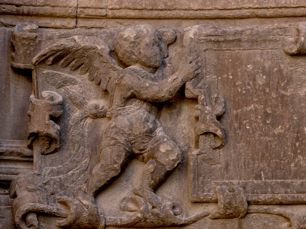 istock winged angel holding nameplate 1733781617