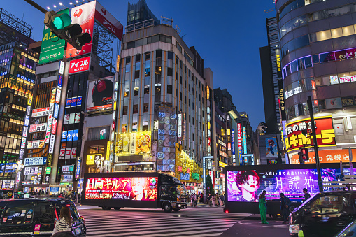 Tokyo, Japan - April 09, 2023: street view at an intersection at Kabukicho, Shinjuku, Tokyo. Kabukicho is an entertainment district in Shinjuku. The area has many movie theaters and is the location of many host and hostess clubs, love hotels