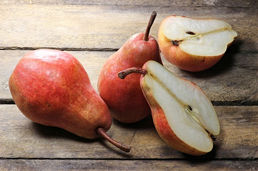 pears (variety Red Bartlett) on wooden background