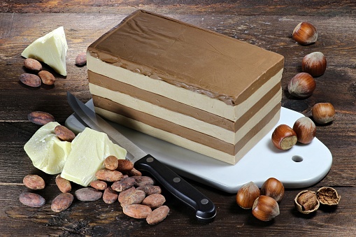 layer nougat cake on wooden background