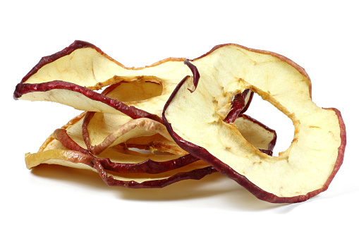 homemade dried apple rings isolated on white background
