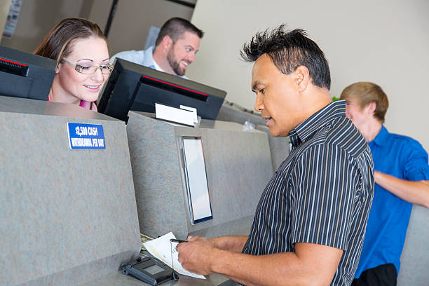 istock Customers at the bank getting money from tellers 173380009