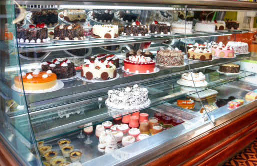 Cakes for sale in refrigerated display cabinet
