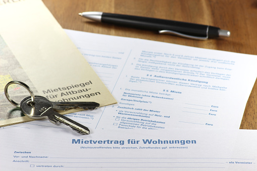German lease contract with rent index on desktop