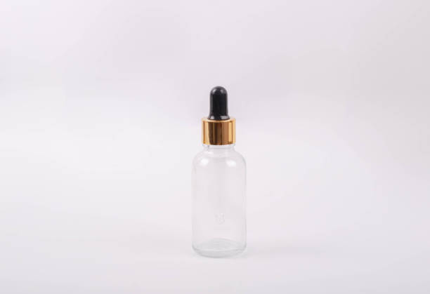 istock Clear glass bottle for facial serum. 1733834632