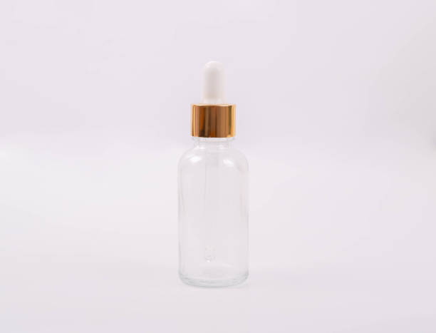istock Clear glass bottle for facial serum. 1733834633
