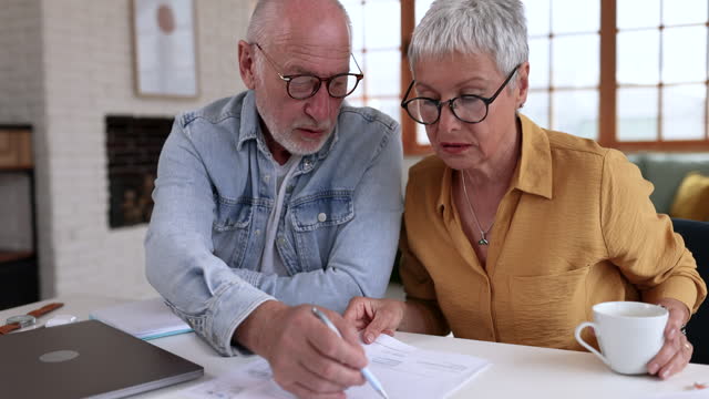 Senior couple planning finances at home
